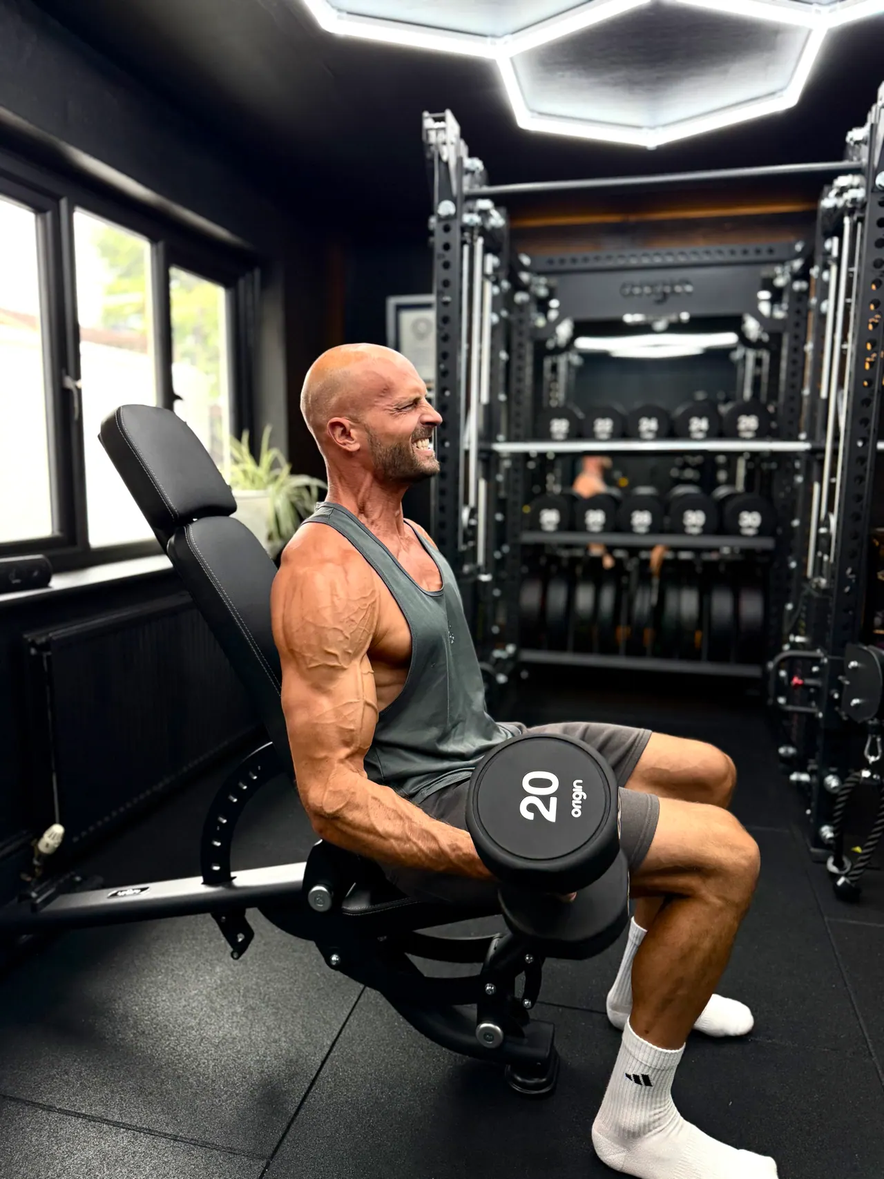 Daniel on a weights machine in the gym