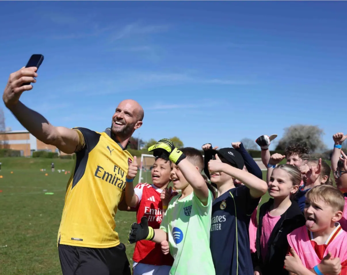 Daniel with a group of children at a camp