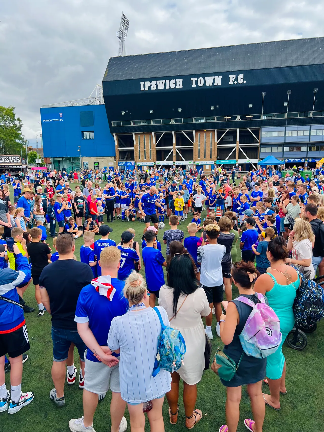 Daniel performing to a crowd of kids at Ipswich Town