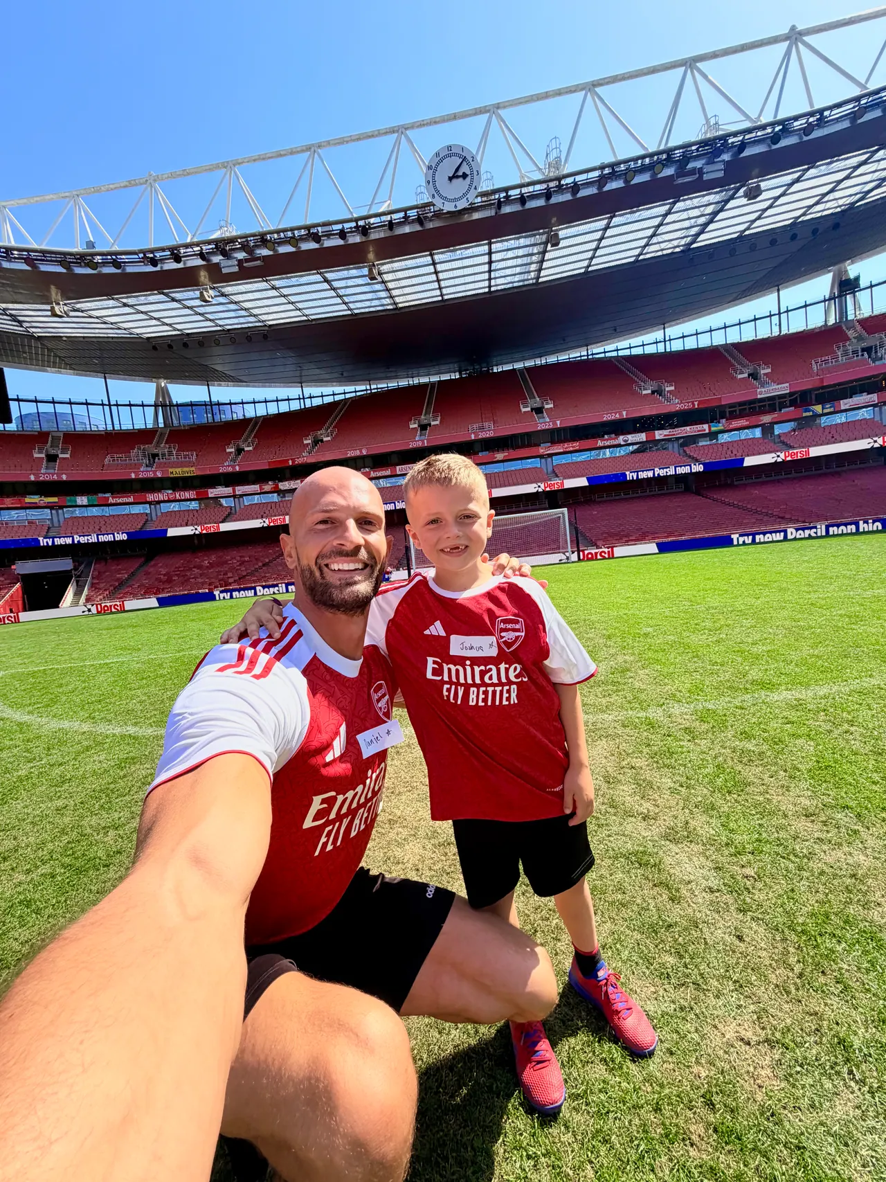 Daniel and Joshua on the pitch at the Emirates